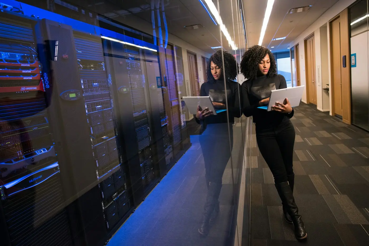 Engineer reviewing a server room